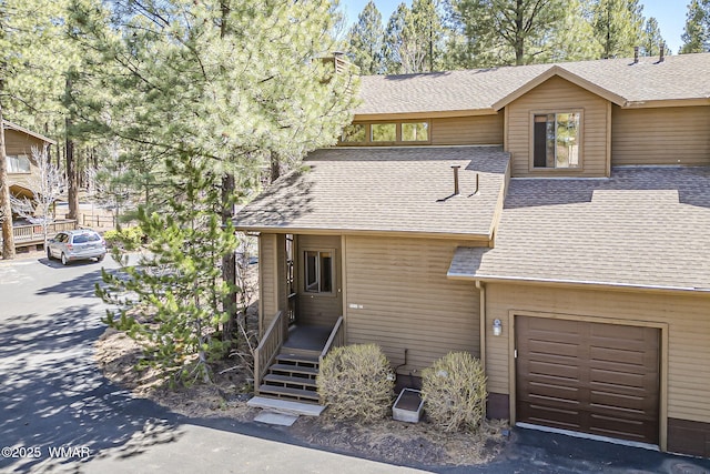 4509 Stone Pine Dr, Pinetop, AZ 85935 - view of front of home with roof with shingles and a chimney