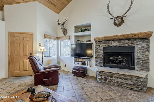 4509 Stone Pine Dr, Pinetop, AZ 85935 - living area featuring built in features, wooden ceiling, high vaulted ceiling, and a stone fireplace