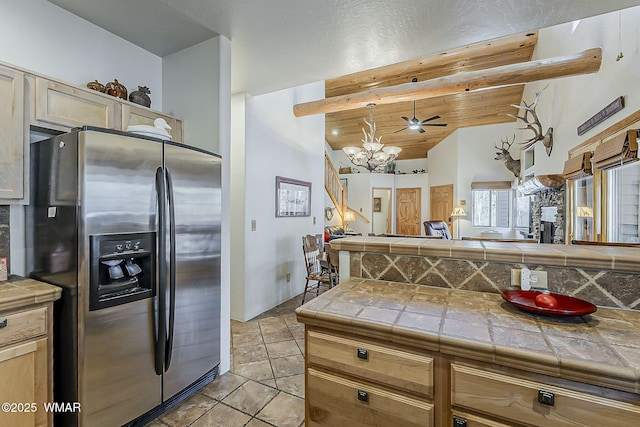 4509 Stone Pine Dr, Pinetop, AZ 85935 - kitchen with stainless steel fridge with ice dispenser, tile countertops, a chandelier, light tile patterned flooring, and open floor plan