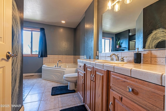 7046 Dusty Saddle Trl, Show Low, AZ 85901 - full bathroom with tile patterned floors, a garden tub, vanity, toilet, and baseboards
