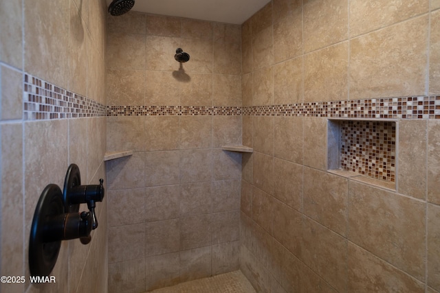 details featuring tiled shower