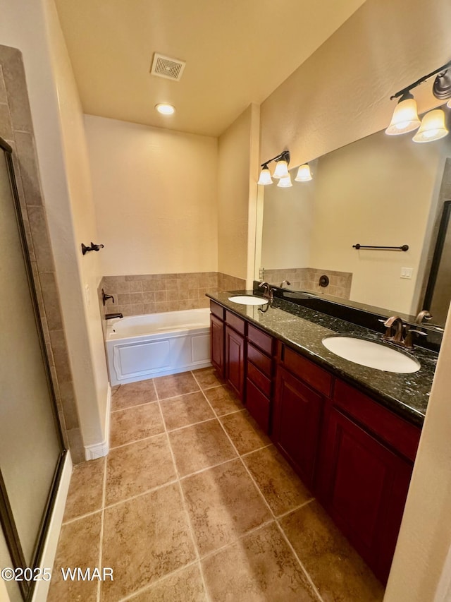 5200 S Morgan Mountain Dr, Show Low, AZ 85901 - full bathroom with double vanity, a garden tub, tile patterned floors, and a stall shower
