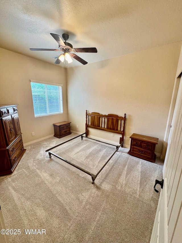 5200 S Morgan Mountain Dr, Show Low, AZ 85901 - bedroom with carpet flooring, a textured ceiling, and a ceiling fan