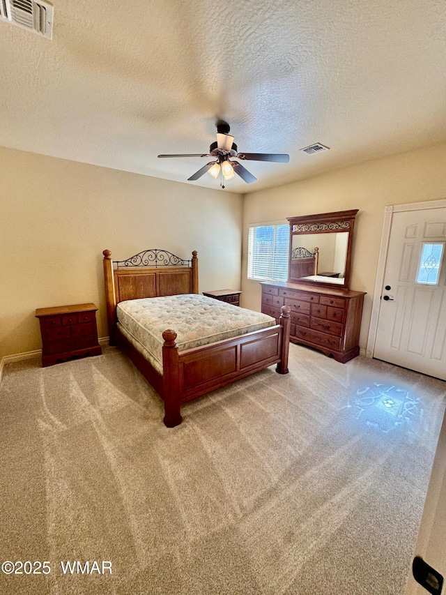 5200 S Morgan Mountain Dr, Show Low, AZ 85901 - bedroom featuring multiple windows, light colored carpet, a textured ceiling, and ceiling fan