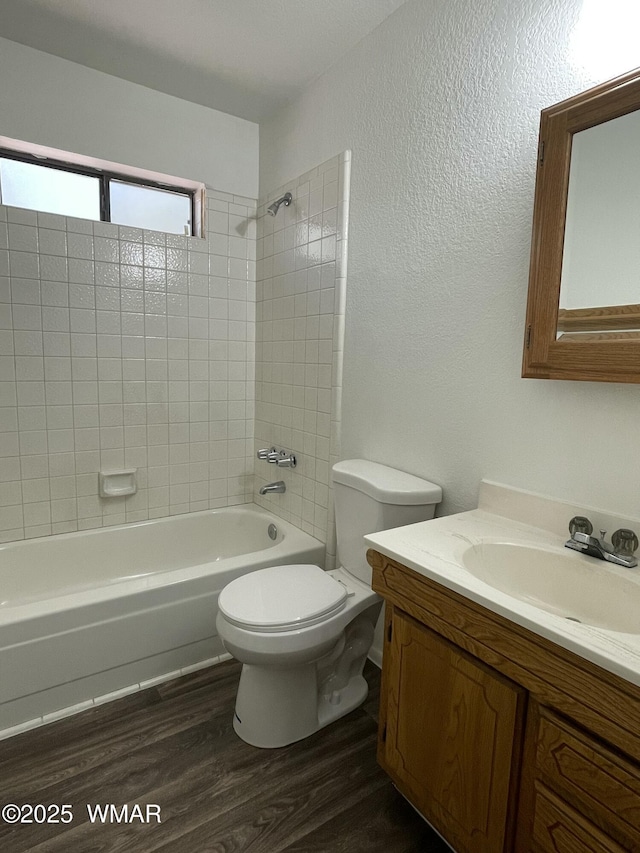7204 Mark Twain Dr, Pinetop, AZ 85935 - full bathroom with a textured wall, shower / tub combination, toilet, wood finished floors, and vanity