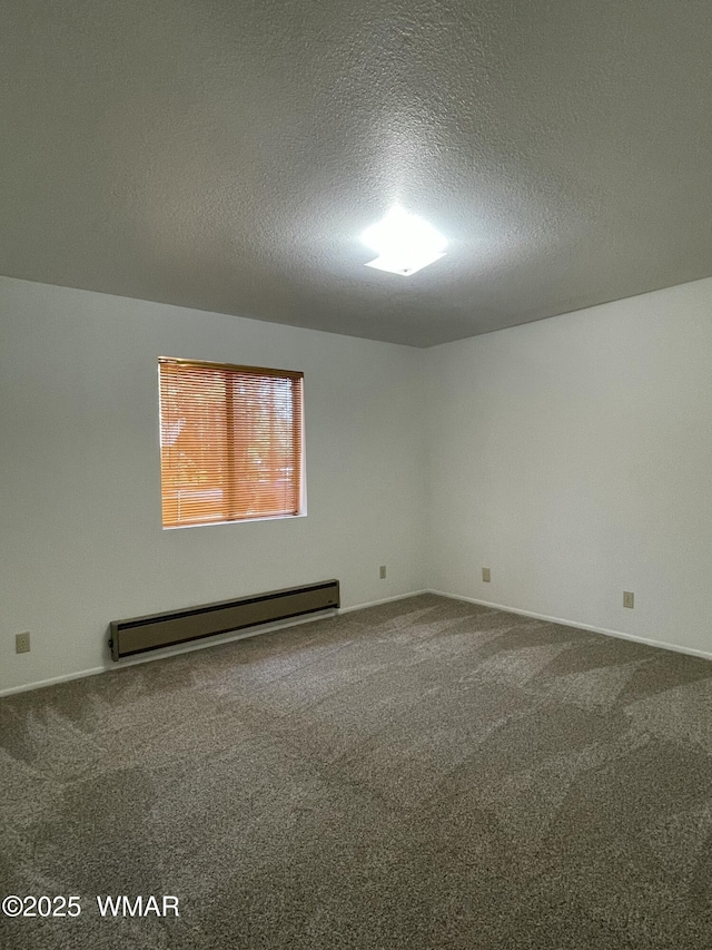 7204 Mark Twain Dr, Pinetop, AZ 85935 - empty room featuring a baseboard heating unit, a textured ceiling, and carpet flooring