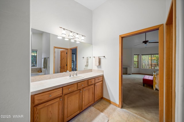 20 W Suncrest Ct, Show Low, AZ 85901 - bathroom with vanity, baseboards, ensuite bath, and a high ceiling