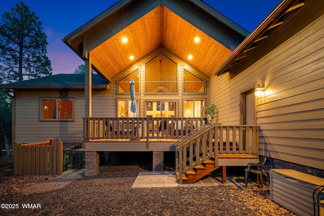 20 W Suncrest Ct, Show Low, AZ 85901 - back of property at dusk with a wooden deck and central AC unit