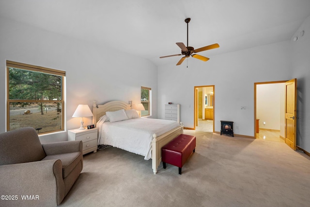 20 W Suncrest Ct, Show Low, AZ 85901 - bedroom featuring ceiling fan, baseboards, high vaulted ceiling, connected bathroom, and light carpet