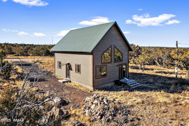 exterior space featuring metal roof