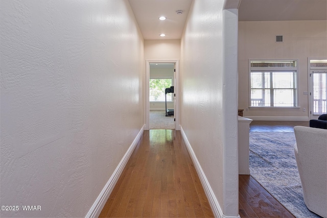 416 S 2nd St, Snowflake, AZ 85937 - hall featuring wood-type flooring, baseboards, a textured wall, arched walkways, and recessed lighting