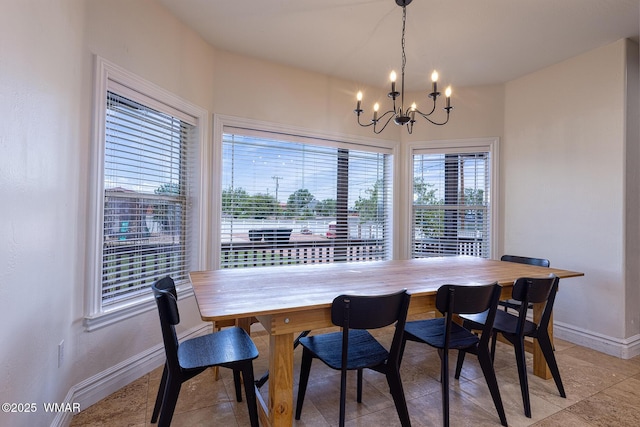 416 S 2nd St, Snowflake, AZ 85937 - dining area with a chandelier, baseboards, plenty of natural light, and light tile patterned floors