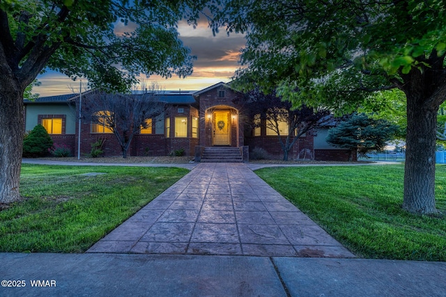 416 S 2nd St, Snowflake, AZ 85937 - view of front of property featuring brick siding and a front lawn