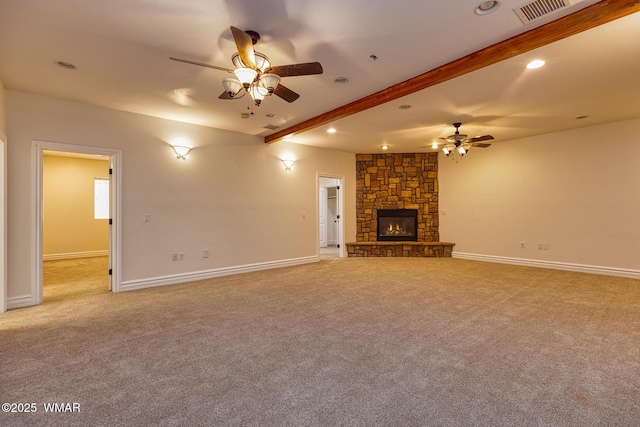 416 S 2nd St, Snowflake, AZ 85937 - unfurnished living room with a ceiling fan, light carpet, beamed ceiling, a fireplace, and baseboards