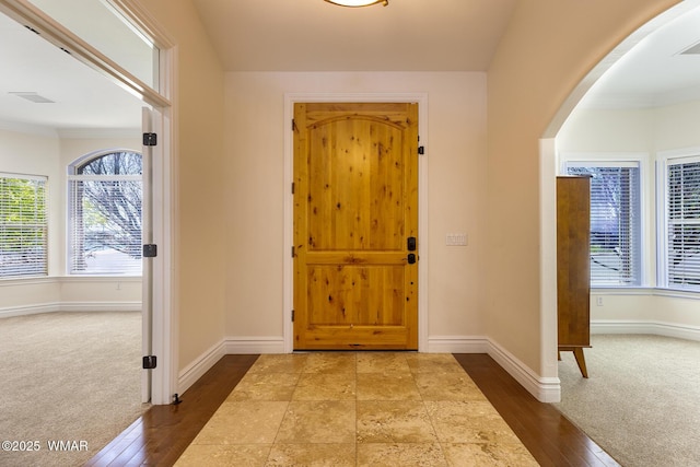 416 S 2nd St, Snowflake, AZ 85937 - entrance foyer featuring baseboards, arched walkways, and carpet
