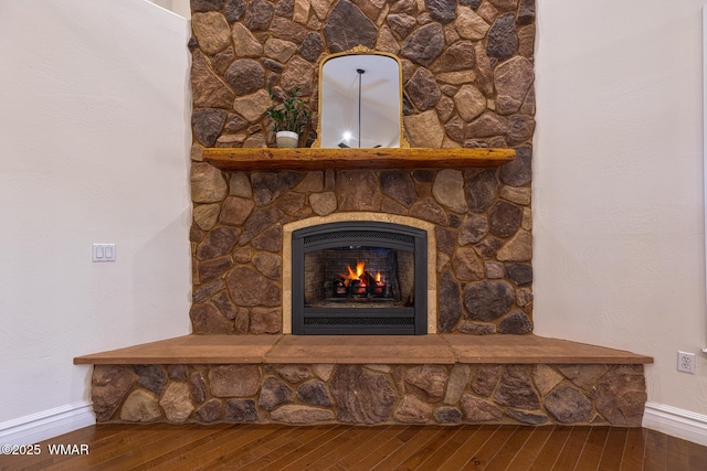 416 S 2nd St, Snowflake, AZ 85937 - detailed view of baseboards, wood finished floors, and a fireplace