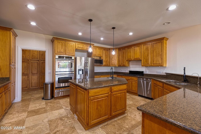 416 S 2nd St, Snowflake, AZ 85937 - kitchen with appliances with stainless steel finishes, brown cabinets, a warming drawer, dark stone counters, and recessed lighting