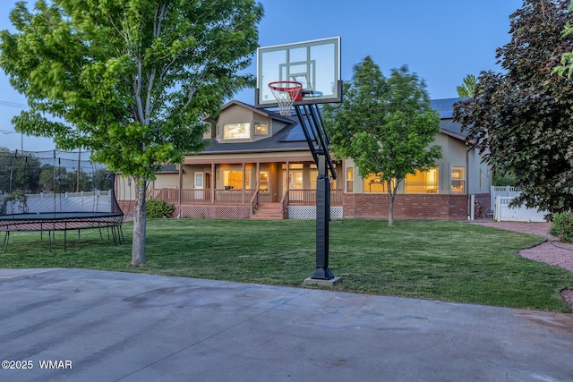 416 S 2nd St, Snowflake, AZ 85937 - view of front of property with a trampoline, a porch, and brick siding