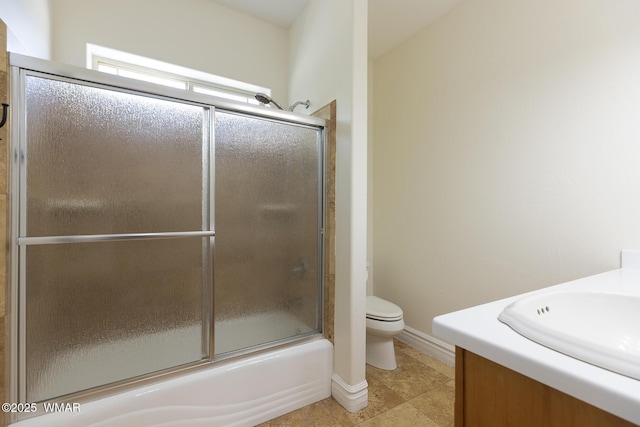 416 S 2nd St, Snowflake, AZ 85937 - bathroom featuring toilet, vanity, shower / bath combination with glass door, baseboards, and tile patterned flooring