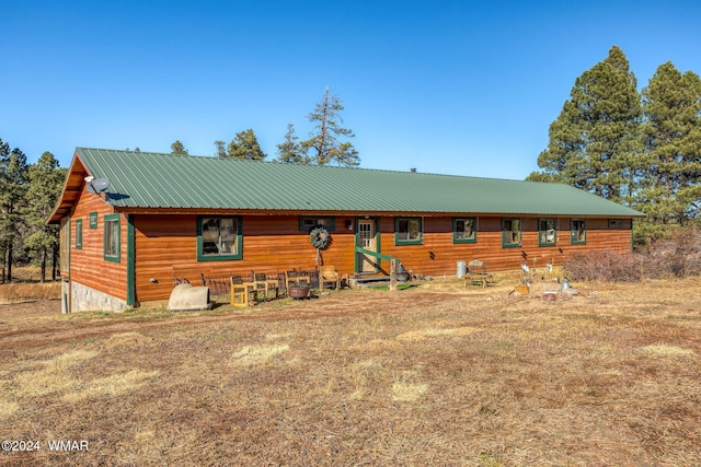 chalet / cabin with entry steps and metal roof