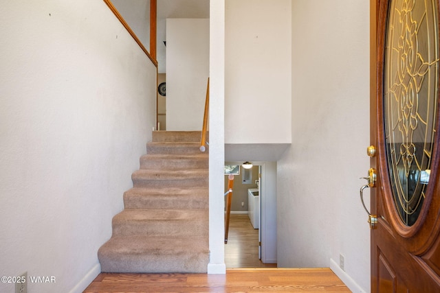 staircase featuring wood finished floors