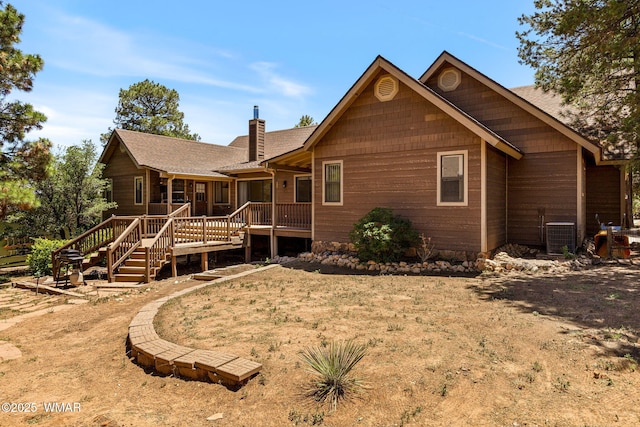 2232 Eagle Ln, Overgaard, AZ 85933 - rear view of house featuring a chimney, a deck, and stairway