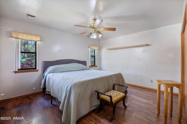 2232 Eagle Ln, Overgaard, AZ 85933 - bedroom with multiple windows, wood finished floors, and a ceiling fan