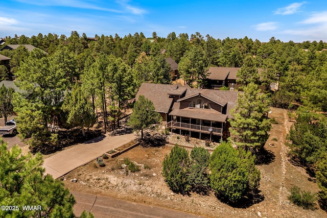 2232 Eagle Ln, Overgaard, AZ 85933 - aerial view of property and surrounding area with a heavily wooded area