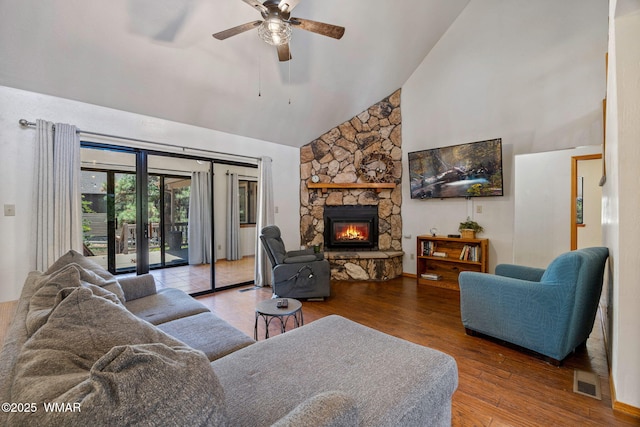 2232 Eagle Ln, Overgaard, AZ 85933 - living room featuring high vaulted ceiling, a ceiling fan, a stone fireplace, and wood finished floors