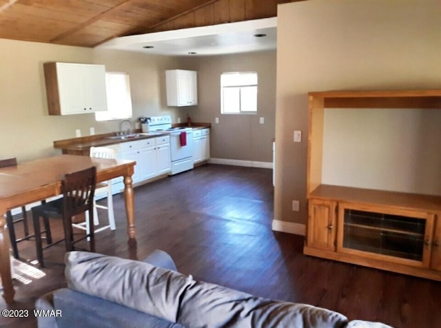 kitchen featuring white electric stove, lofted ceiling, wood ceiling, and white cabinets