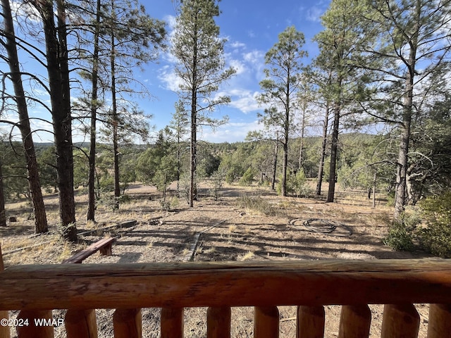 view of yard featuring a wooded view