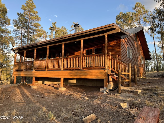 cabin featuring metal roof