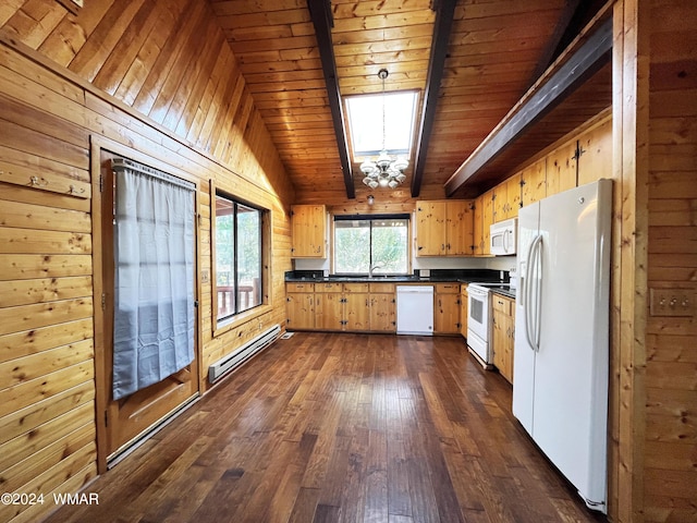 kitchen with white appliances, dark countertops, dark wood-style flooring, baseboard heating, and a sink