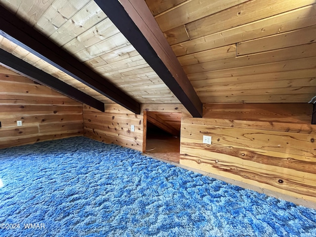 additional living space featuring lofted ceiling with beams, wood ceiling, wooden walls, and carpet flooring