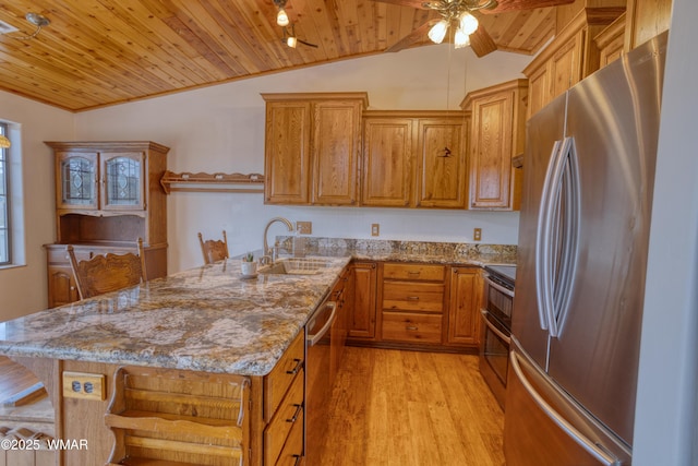 kitchen featuring stainless steel appliances, vaulted ceiling, light wood-type flooring, wooden ceiling, and a peninsula