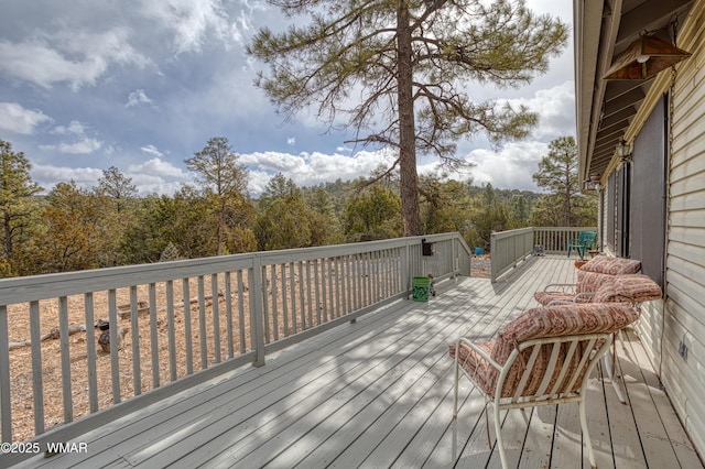 deck featuring a view of trees