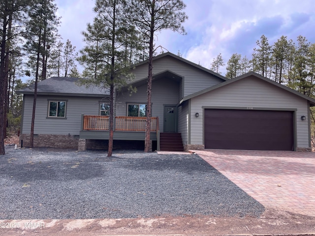 2490 Aspen Run, Pinetop, AZ 85935 - view of front of house featuring decorative driveway, a wooden deck, and a garage