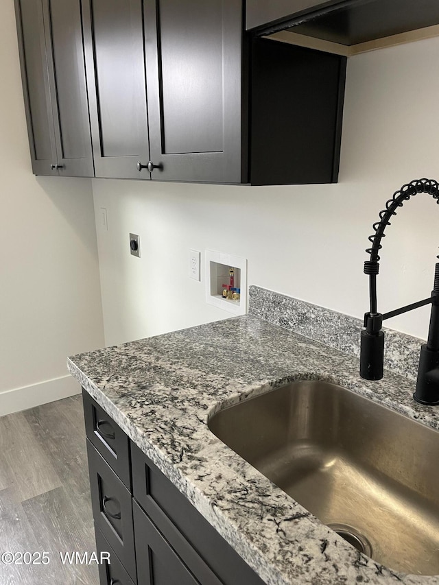 2490 Aspen Run, Pinetop, AZ 85935 - details featuring a sink, baseboards, and wood finished floors