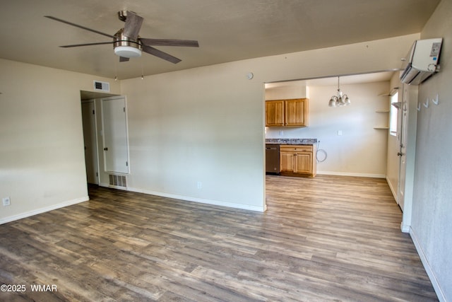 341 W 5th St S, Snowflake, AZ 85937 - unfurnished living room with a wall unit AC, a chandelier, ceiling fan, and wood finished floors