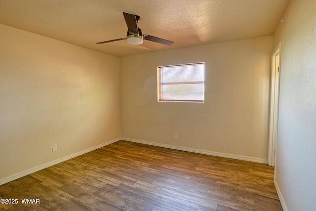 341 W 5th St S, Snowflake, AZ 85937 - empty room featuring wood finished floors, ceiling fan, baseboards, and a textured ceiling