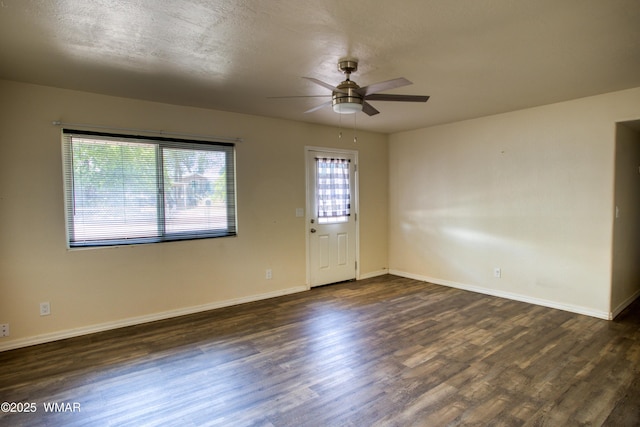 341 W 5th St S, Snowflake, AZ 85937 - spare room with ceiling fan, dark wood-style flooring, and baseboards