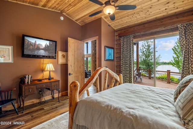 bedroom with vaulted ceiling, multiple windows, wood ceiling, and access to outside