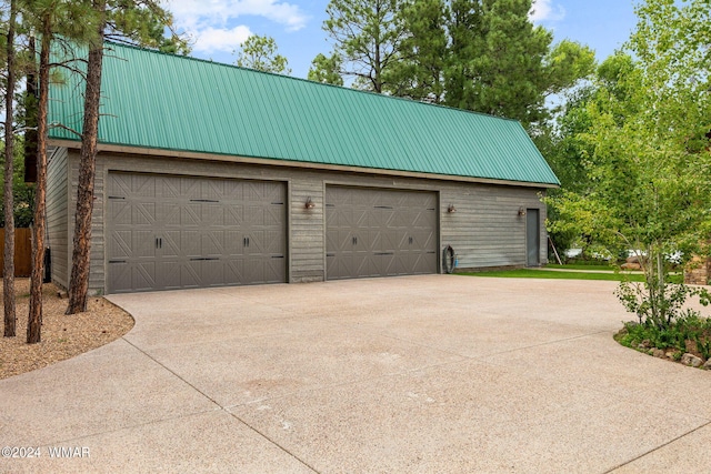 garage featuring driveway