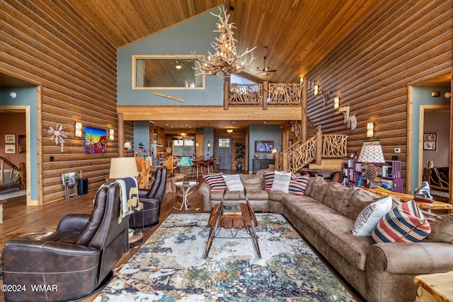 living room featuring high vaulted ceiling, wood finished floors, an inviting chandelier, wooden ceiling, and log walls