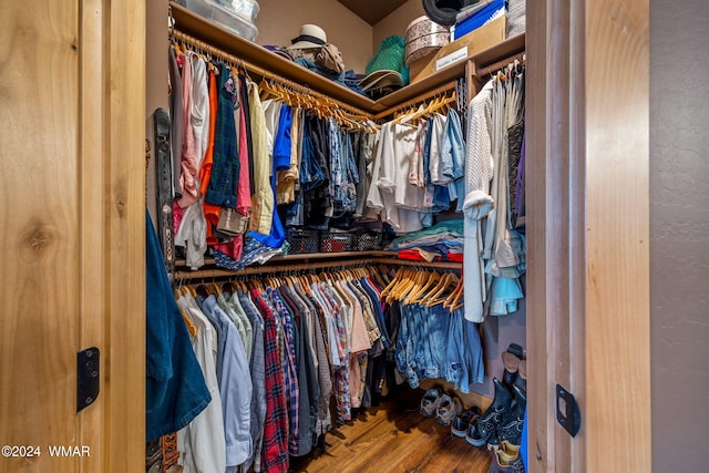 walk in closet featuring wood finished floors