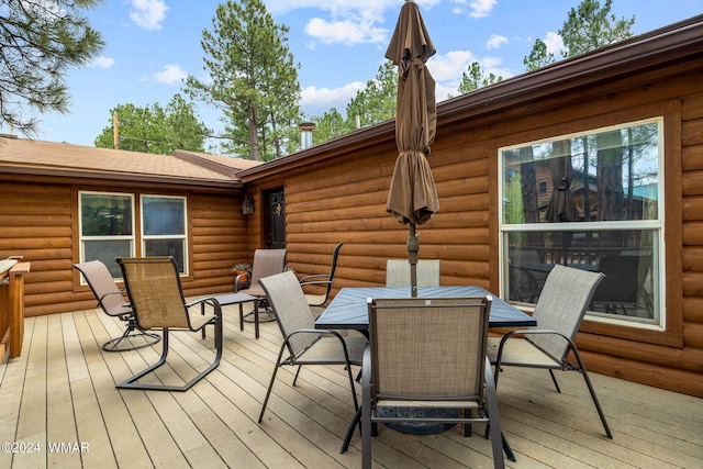 deck with outdoor dining area