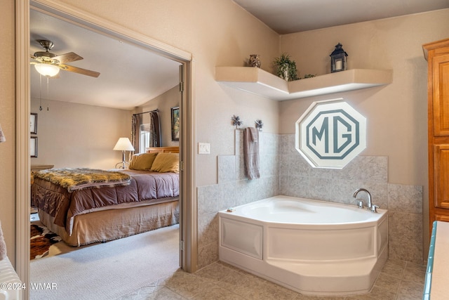 ensuite bathroom with tile patterned flooring, a bath, a ceiling fan, and ensuite bathroom