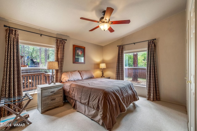 bedroom with light colored carpet, a ceiling fan, and lofted ceiling