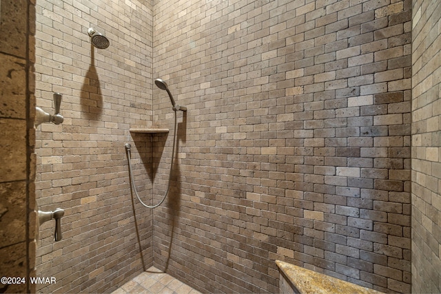 full bathroom with tiled shower