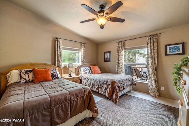 bedroom with carpet, baseboards, ceiling fan, vaulted ceiling, and a textured ceiling